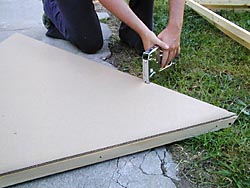 stapling cardboard to wood